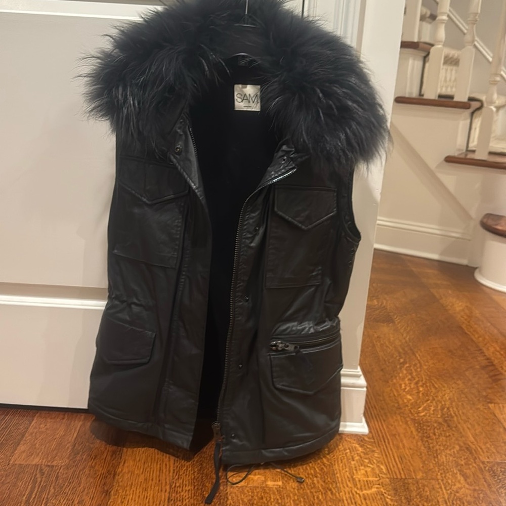 Women’s matte black leather vest with fur hood